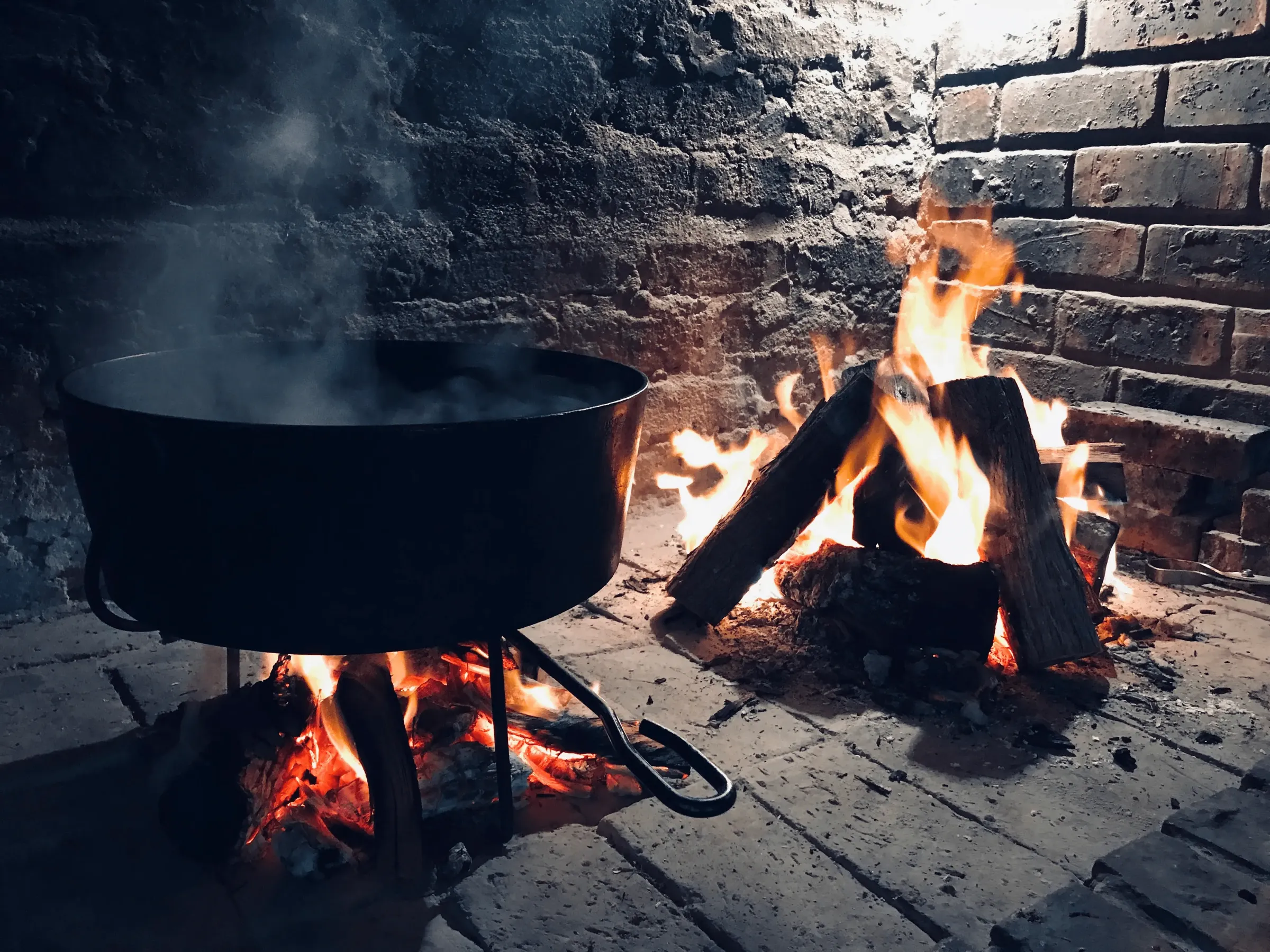 Stone fireplace and braai area at Tarantula Guesthouse